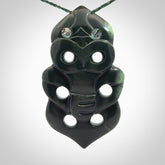 This is a large hand carved New Zealand Jade tiki pendant. It is made from New Zealand Jade and Paua shell.